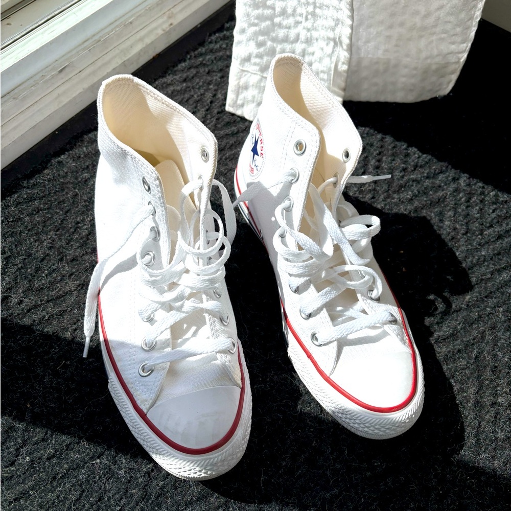 White Chuck Taylor’s only worn twice . Size 8.5 women’s and 6.5 men’s
